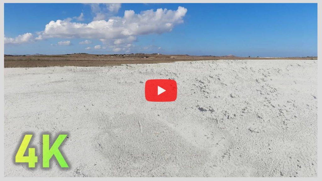 Walking on a Dry Lake (Lagoon) covered with White Pasty Soil